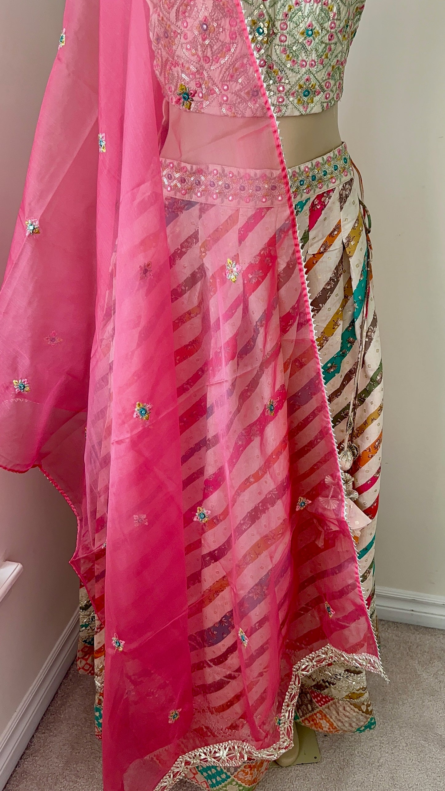 Light Lehenga Set with Sleeveless Sequinned Choli and Net Dupatta Lined with Gota